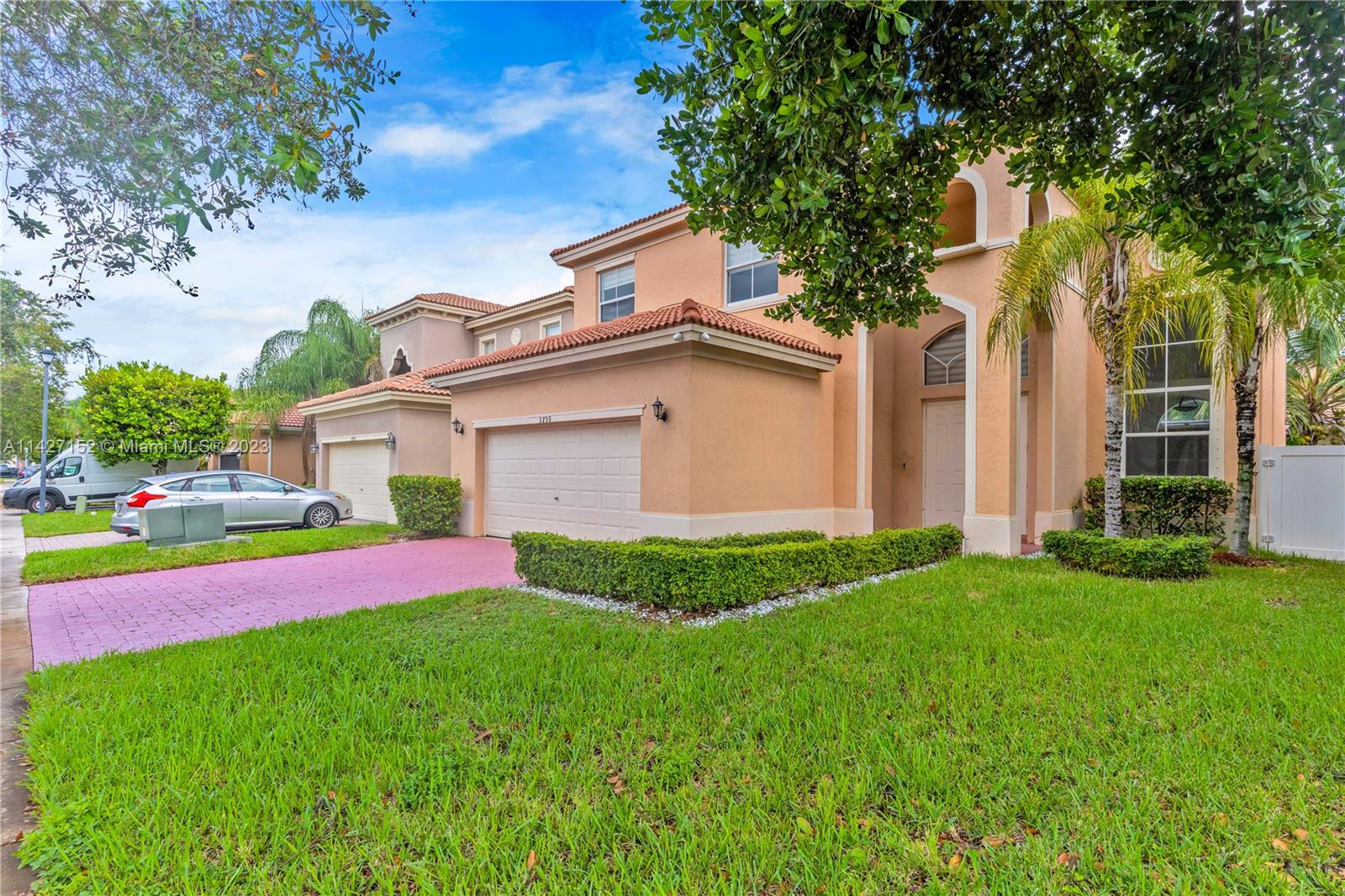 3759 Northeast 15th Street Homestead, FL 33033 - Photo 2 of 55 a front view of a house with a yard and garage