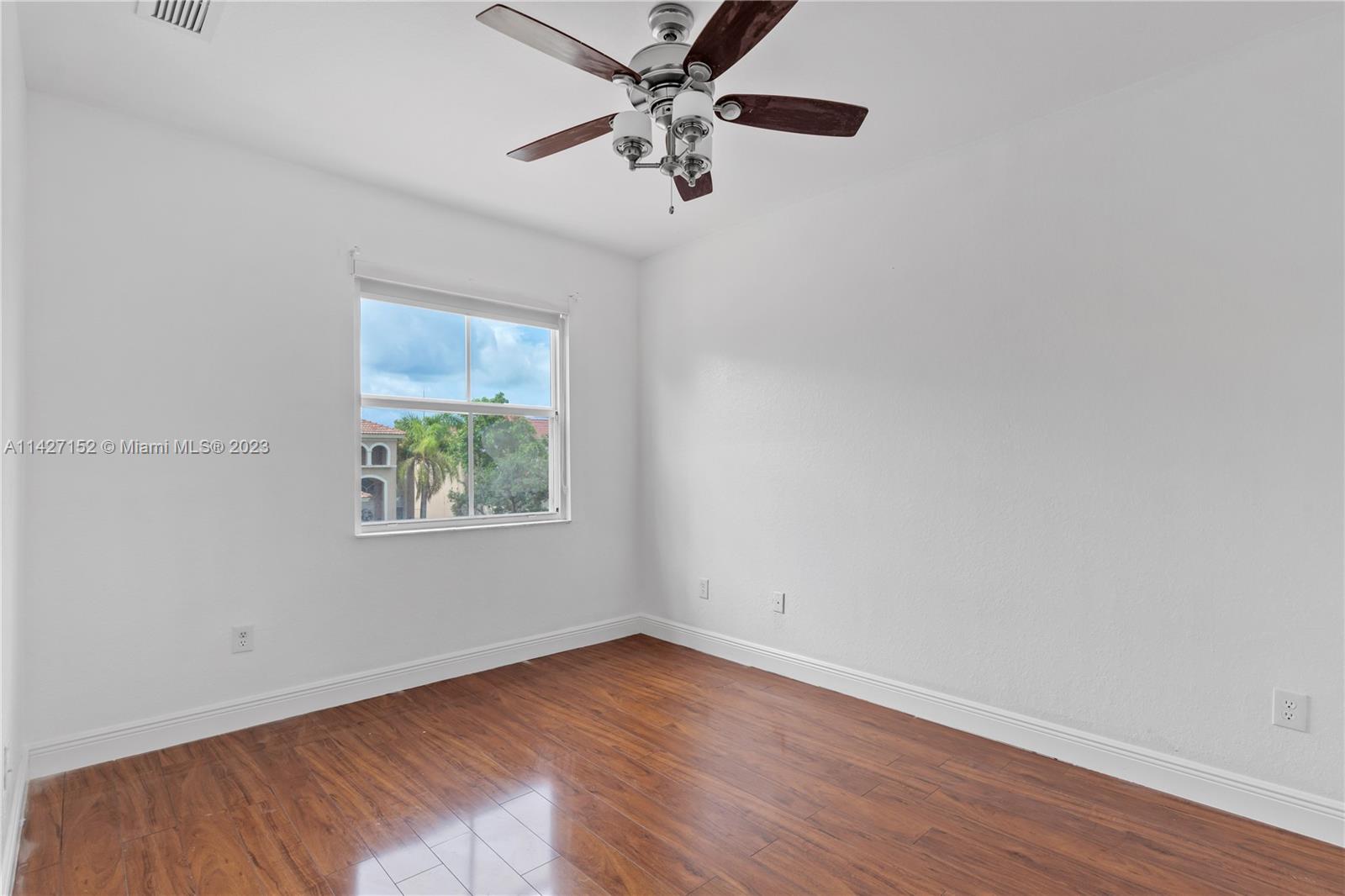 3759 Northeast 15th Street Homestead, FL 33033 - Photo 22 of 55 an empty room with a window and a ceiling fan