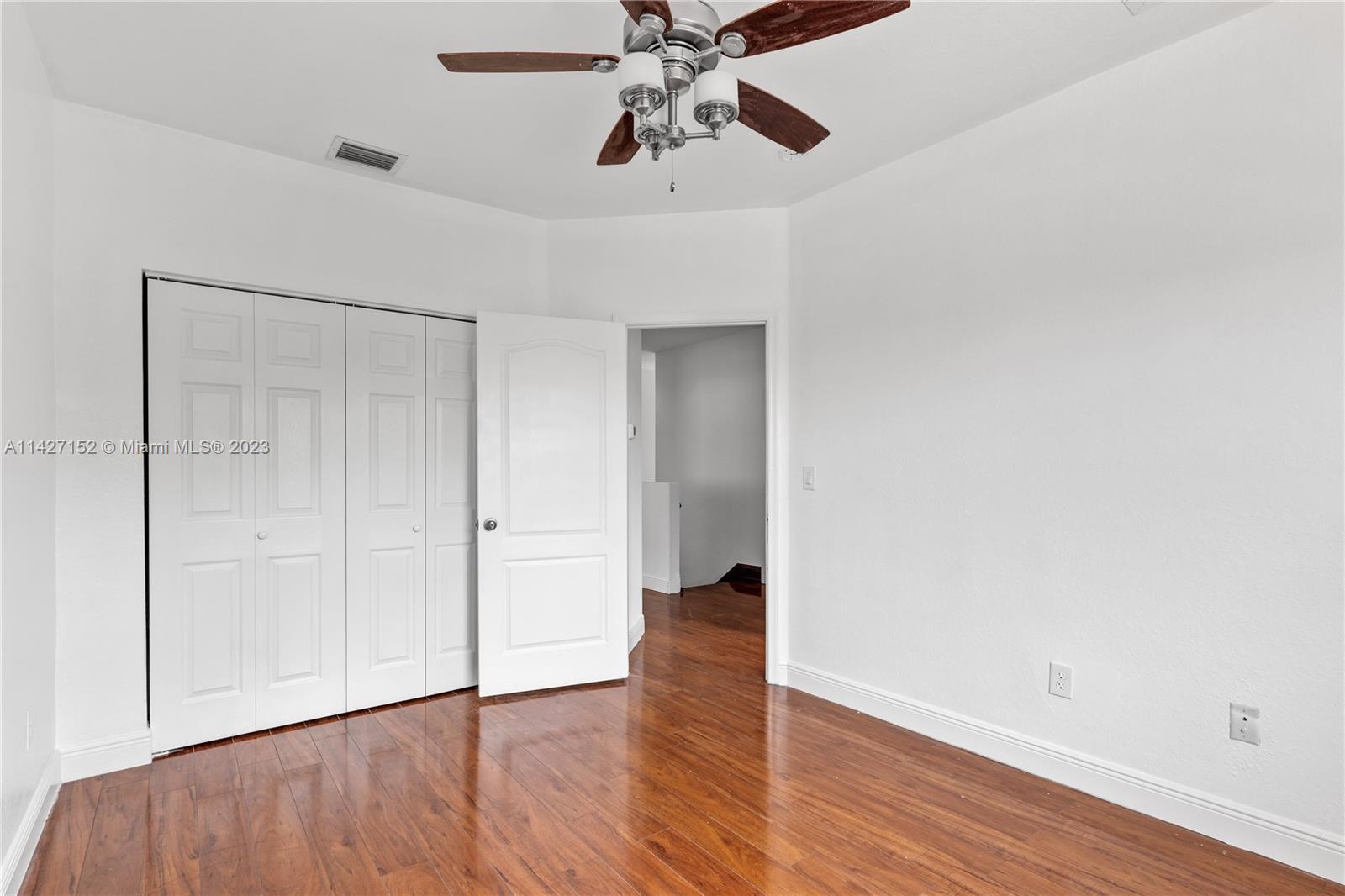 3759 Northeast 15th Street Homestead, FL 33033 - Photo 23 of 55 a view of an empty room with window and wooden floor