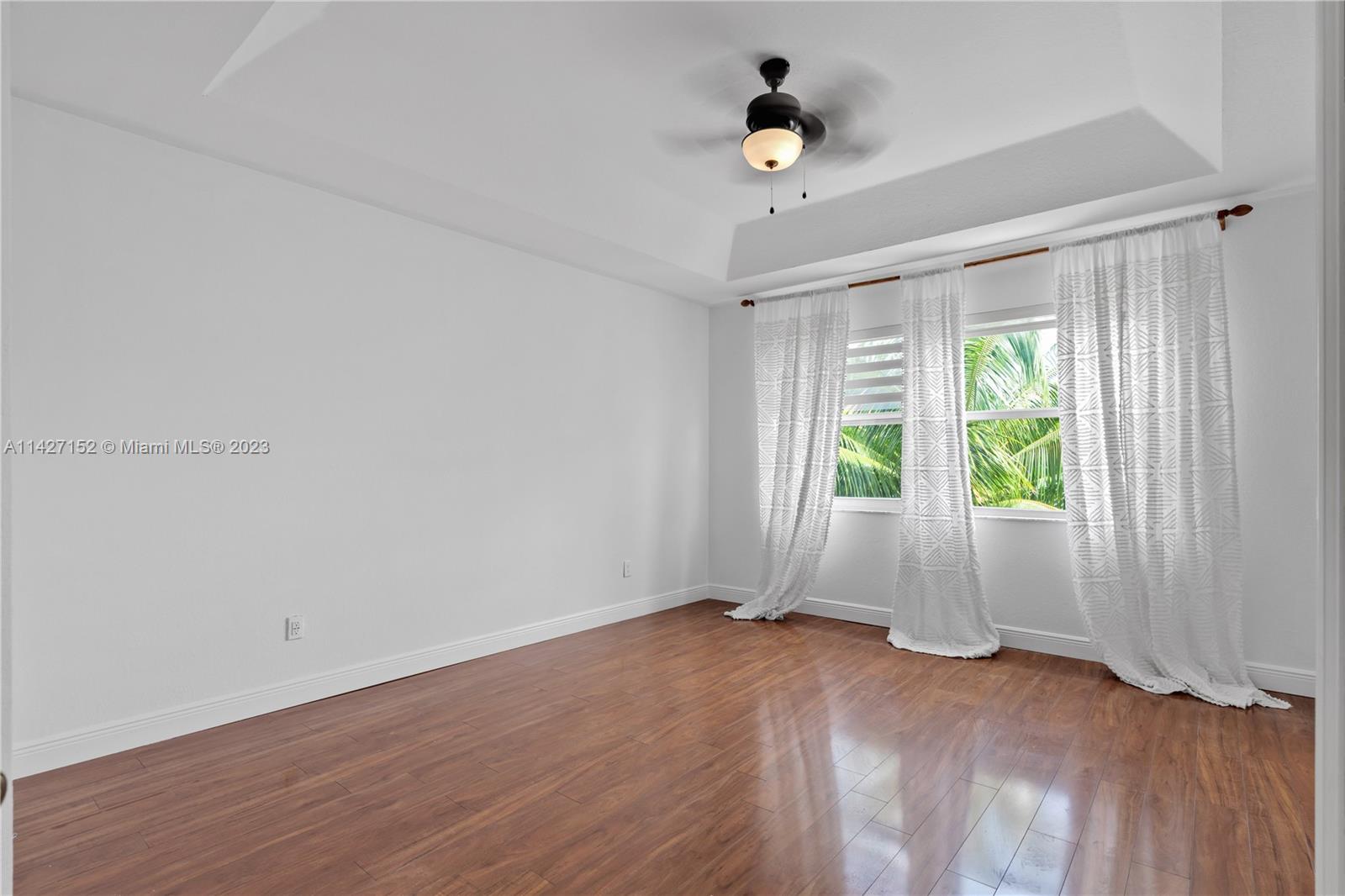 3759 Northeast 15th Street Homestead, FL 33033 - Photo 27 of 55 an empty room with wooden floor and windows