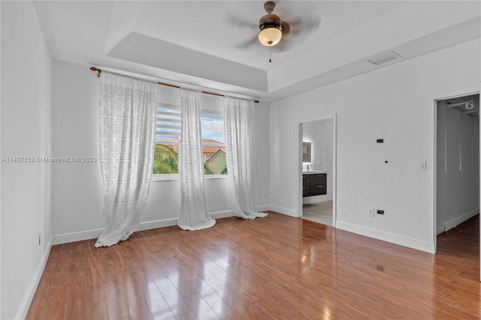 3759 Northeast 15th Street Homestead, FL 33033 - Photo 28 of 55 wooden floor in an empty room with a window