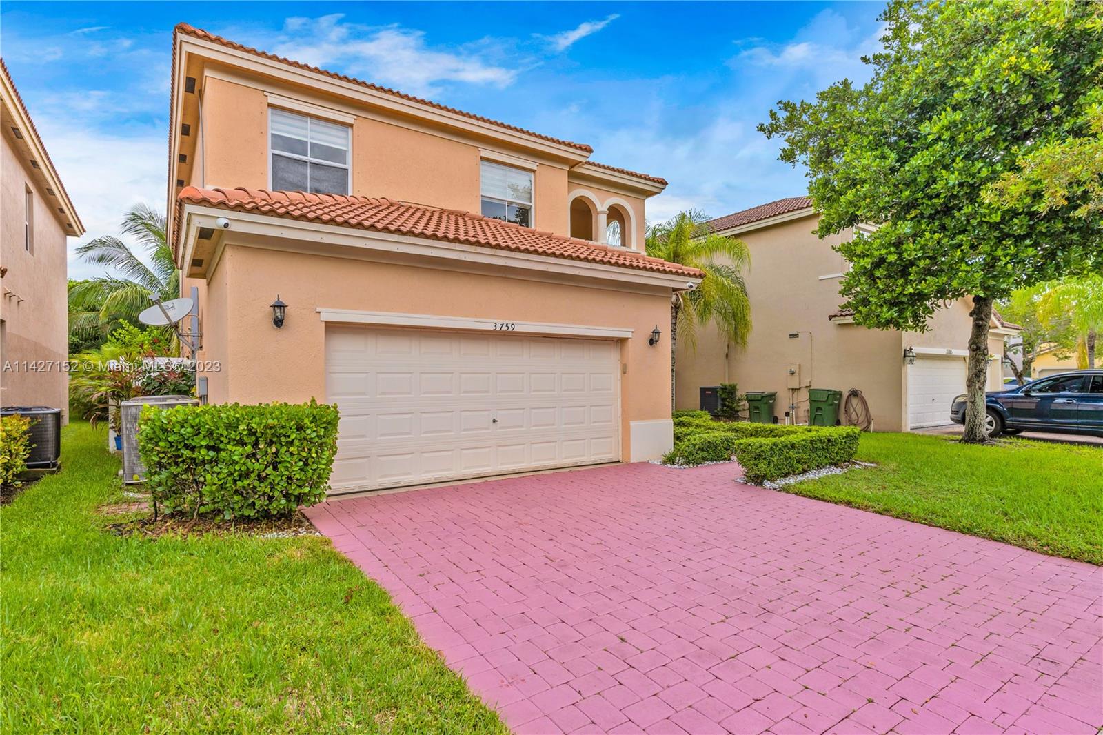 3759 Northeast 15th Street Homestead, FL 33033 - Photo 3 of 55 a front view of a house with a yard and garage