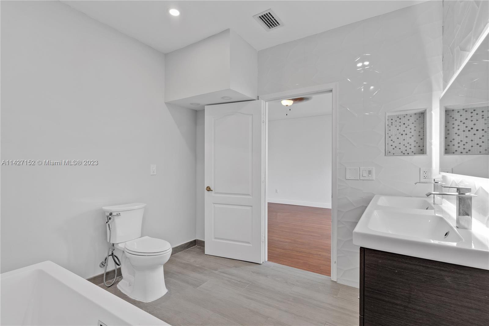 3759 Northeast 15th Street Homestead, FL 33033 - Photo 33 of 55 a bathroom with a sink a toilet and shower