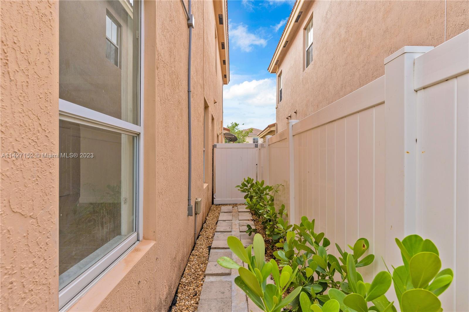 3759 Northeast 15th Street Homestead, FL 33033 - Photo 42 of 55 a view of a entryway with flower pots
