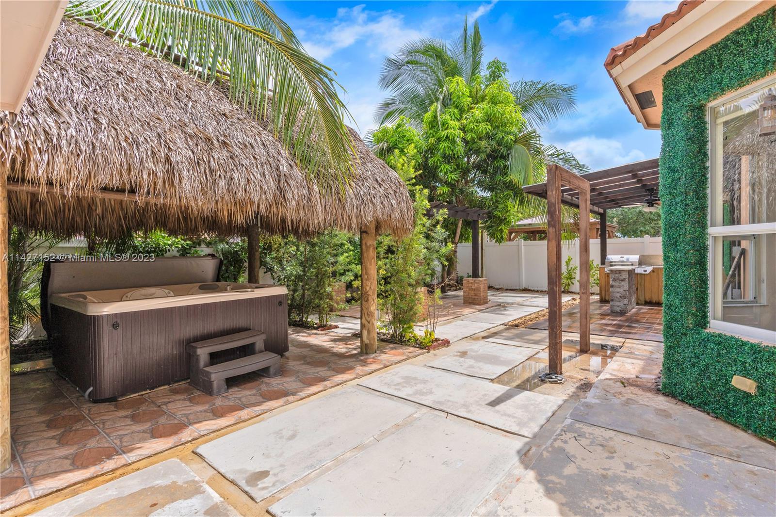 3759 Northeast 15th Street Homestead, FL 33033 - Photo 50 of 55 a view of backyard with barbeque grill and outdoor seating