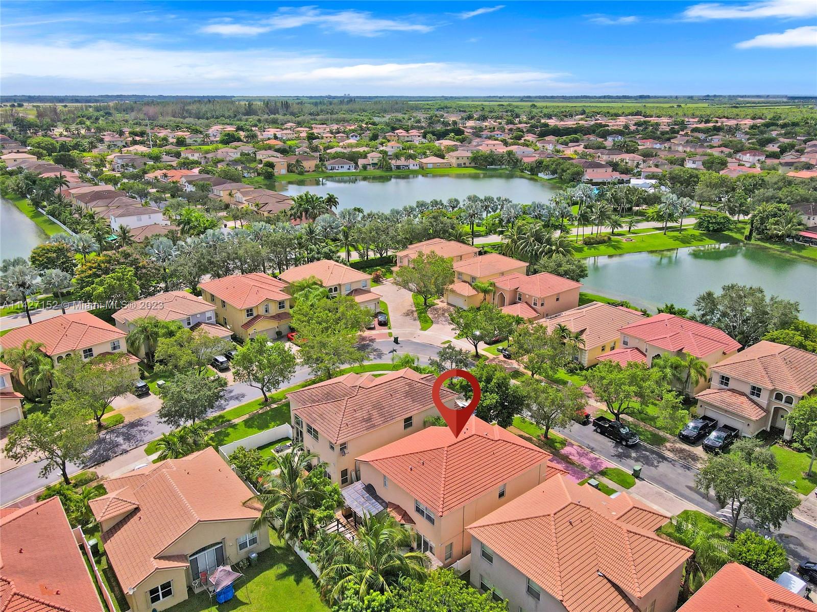 3759 Northeast 15th Street Homestead, FL 33033 - Photo 53 of 55 an aerial view of a city with lots of residential buildings lake and ocean view