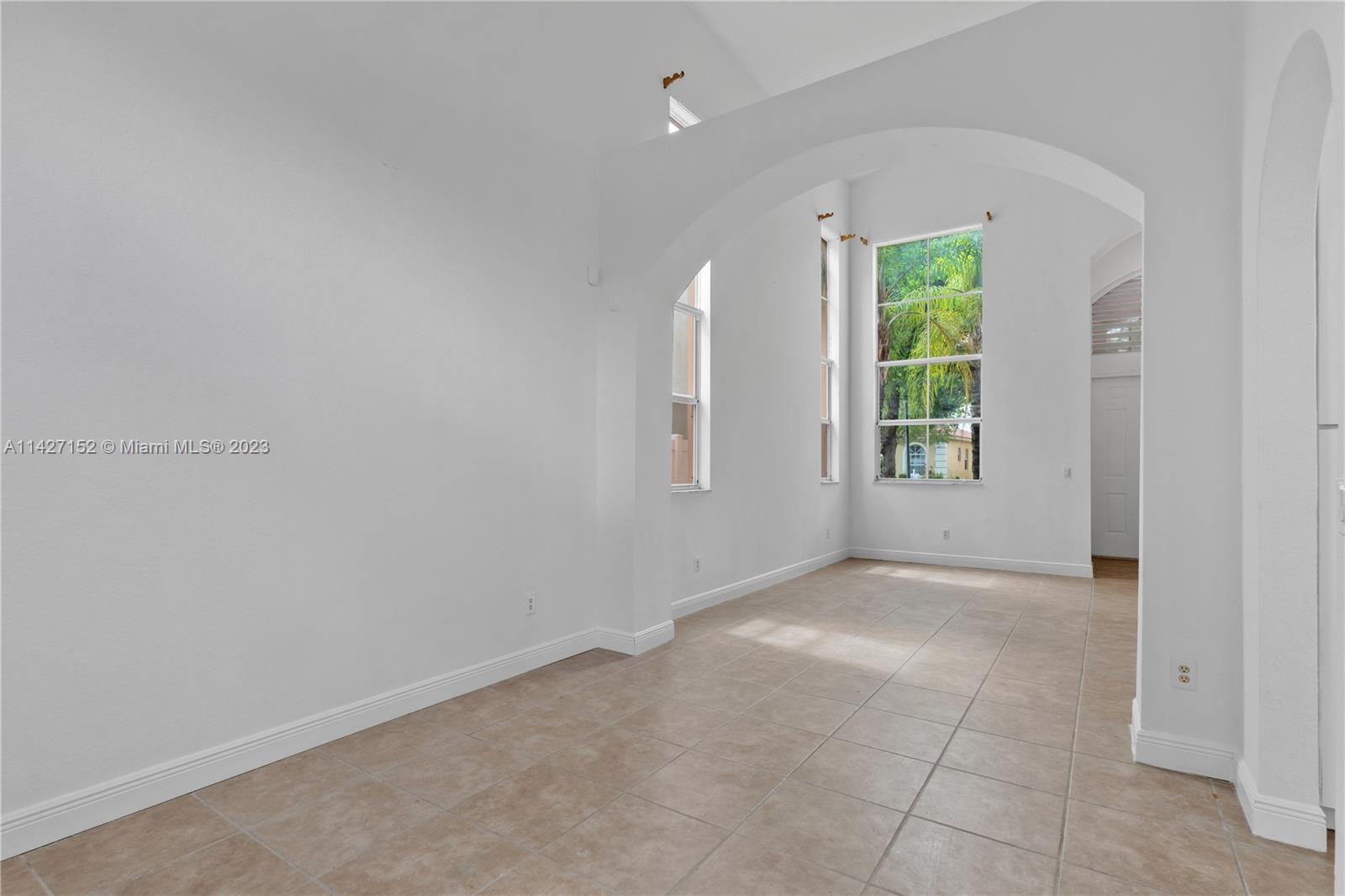 3759 Northeast 15th Street Homestead, FL 33033 - Photo 8 of 55 an empty room with windows and closet