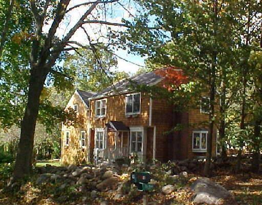 19 Cannondale Road Weston, CT 06883 - Photo 1 of 1 a front view of a house with a yard