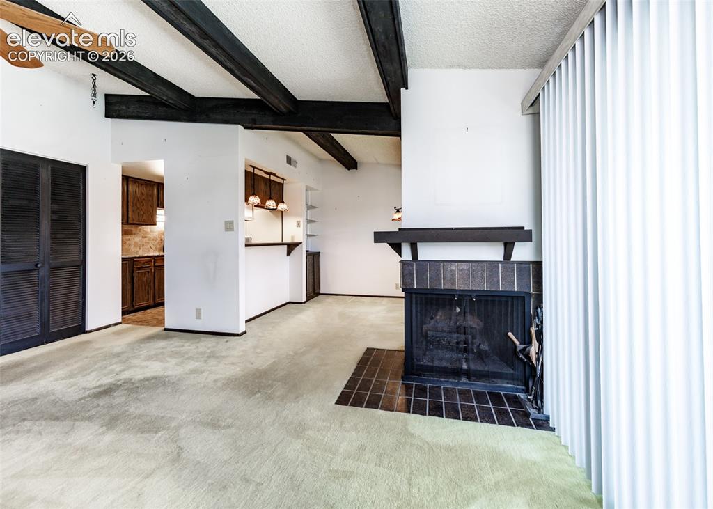 1034 Fontmore Road, Unit D Colorado Springs, CO 80904 - Photo 12 of 43 a room with fireplace and cabinets