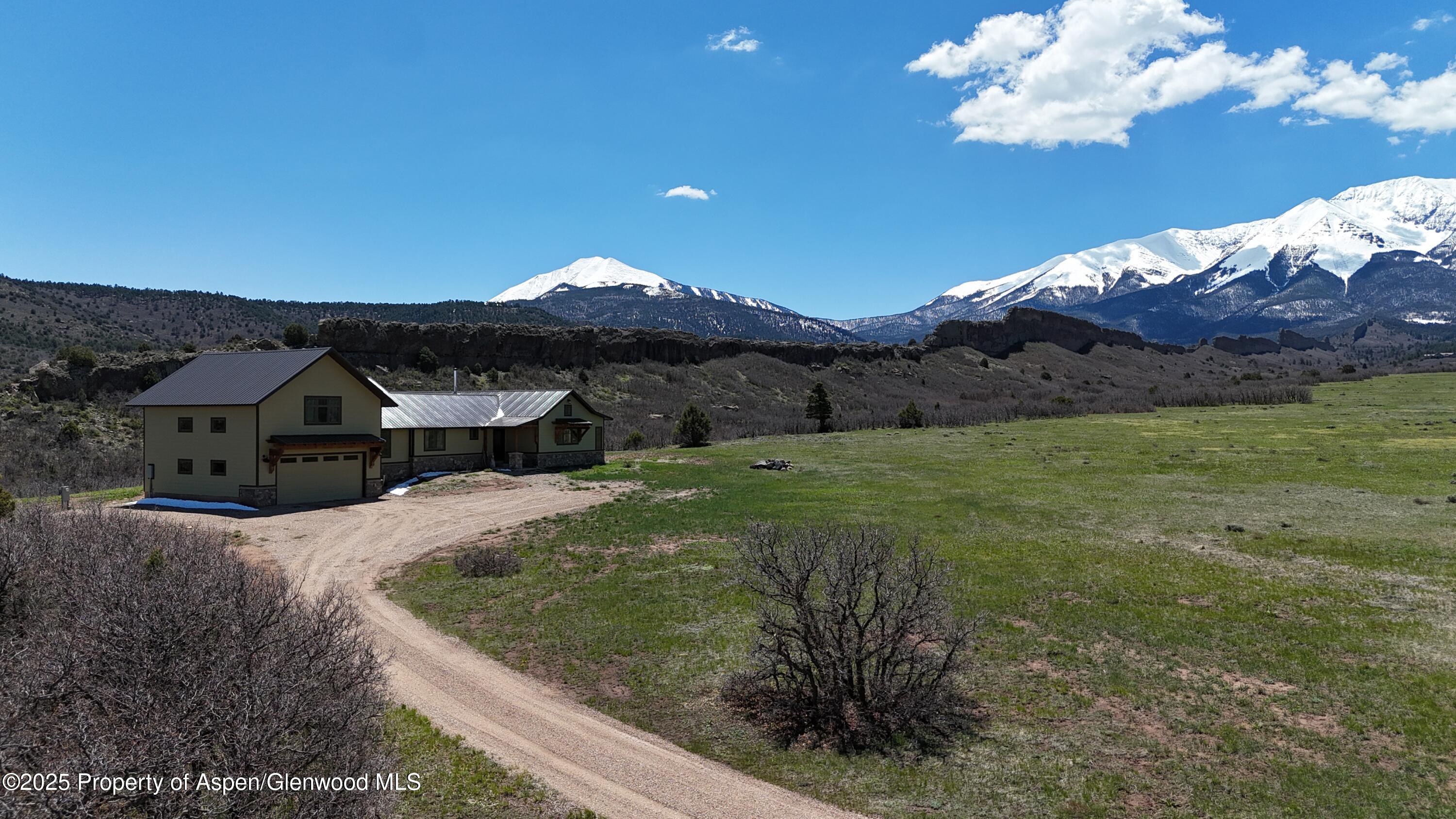 741 Big Wall Lane La Veta, CO 81055 - Photo 1 of 47 a view of a house with a yard