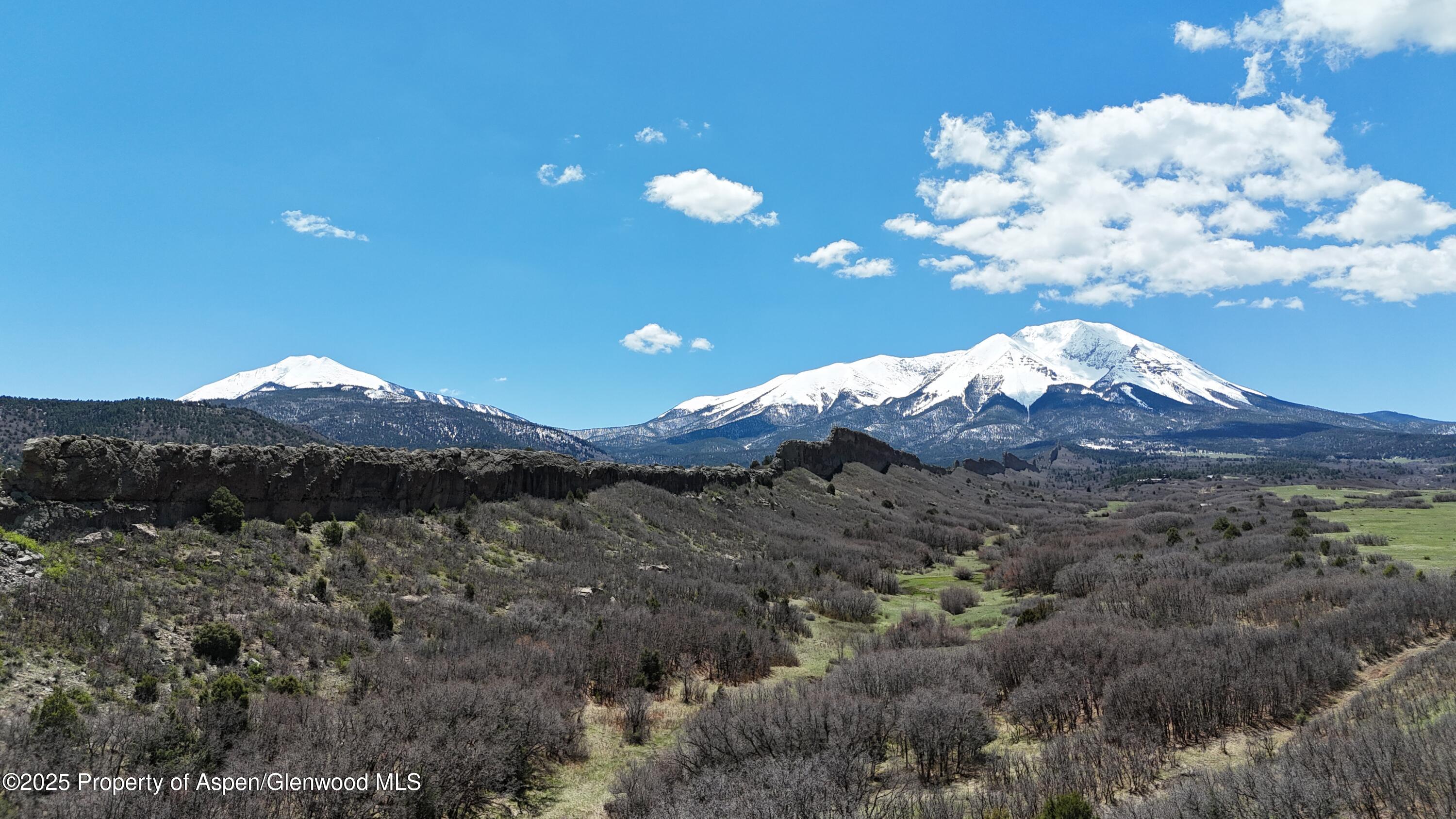 741 Big Wall Lane La Veta, CO 81055 - Photo 13 of 47 a view of a backyard with green space