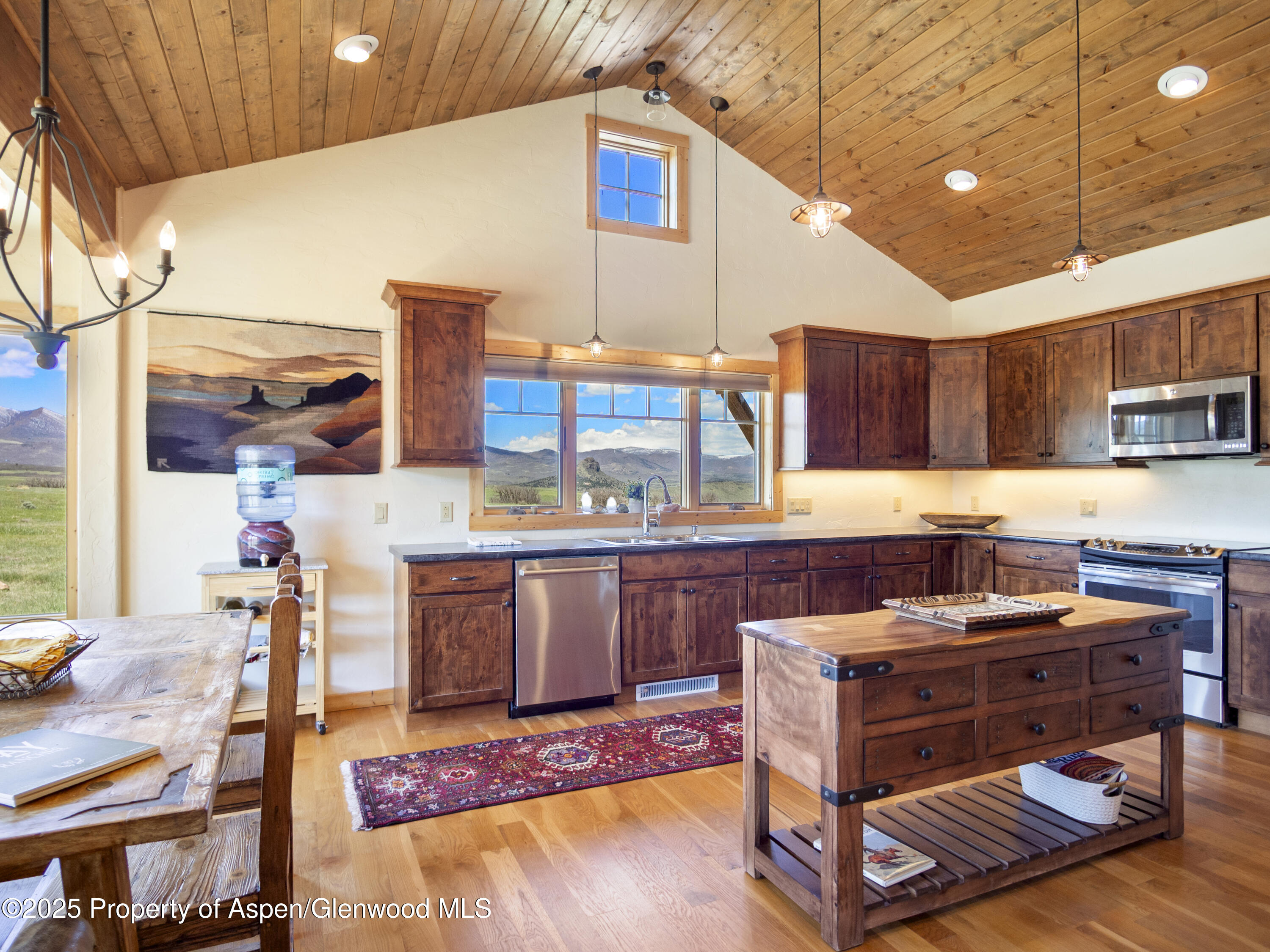 741 Big Wall Lane La Veta, CO 81055 - Photo 27 of 47 a kitchen with stainless steel appliances granite countertop a stove and a sink