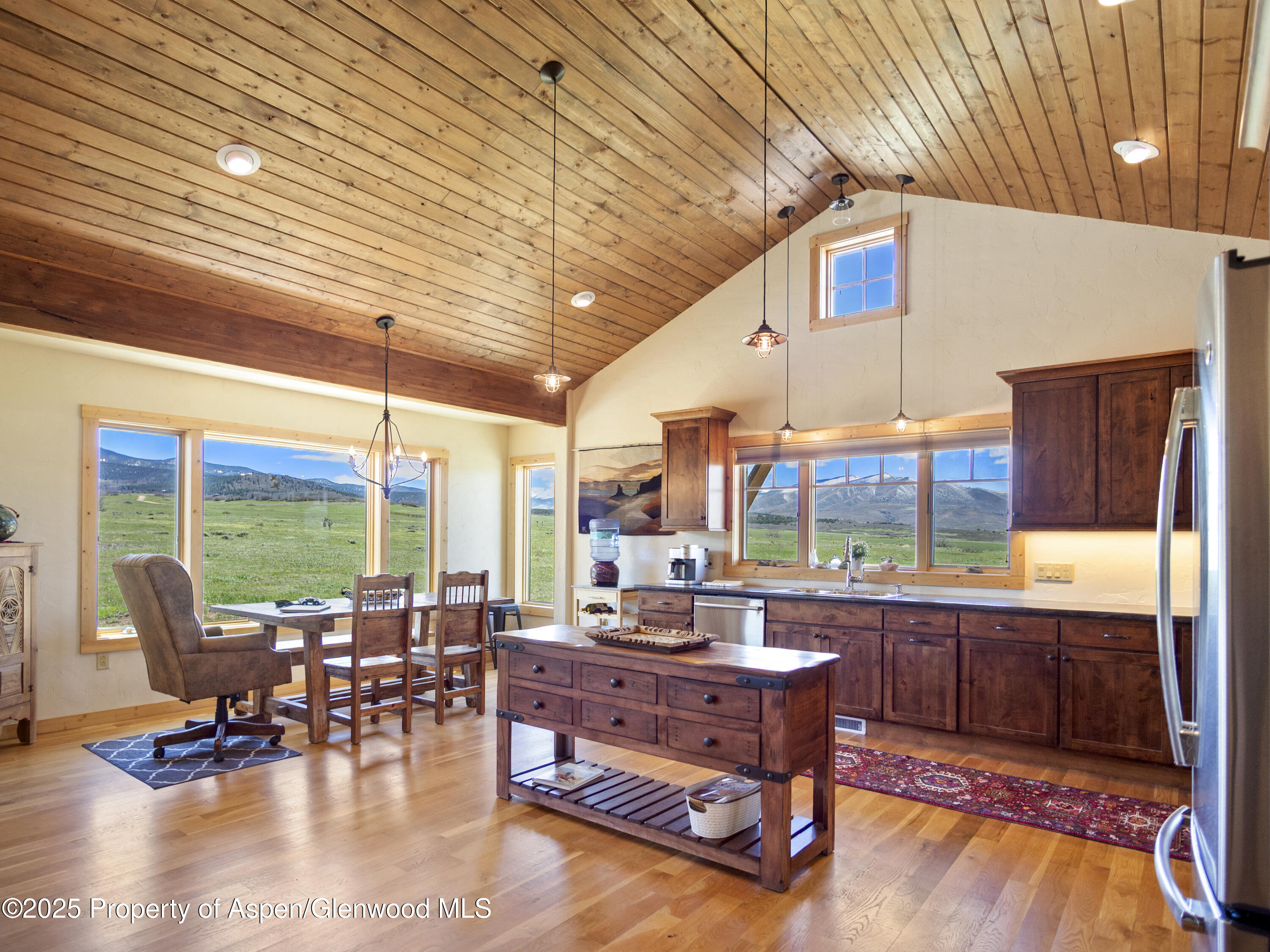 741 Big Wall Lane La Veta, CO 81055 - Photo 32 of 47 a living room with patio furniture and a floor to ceiling window