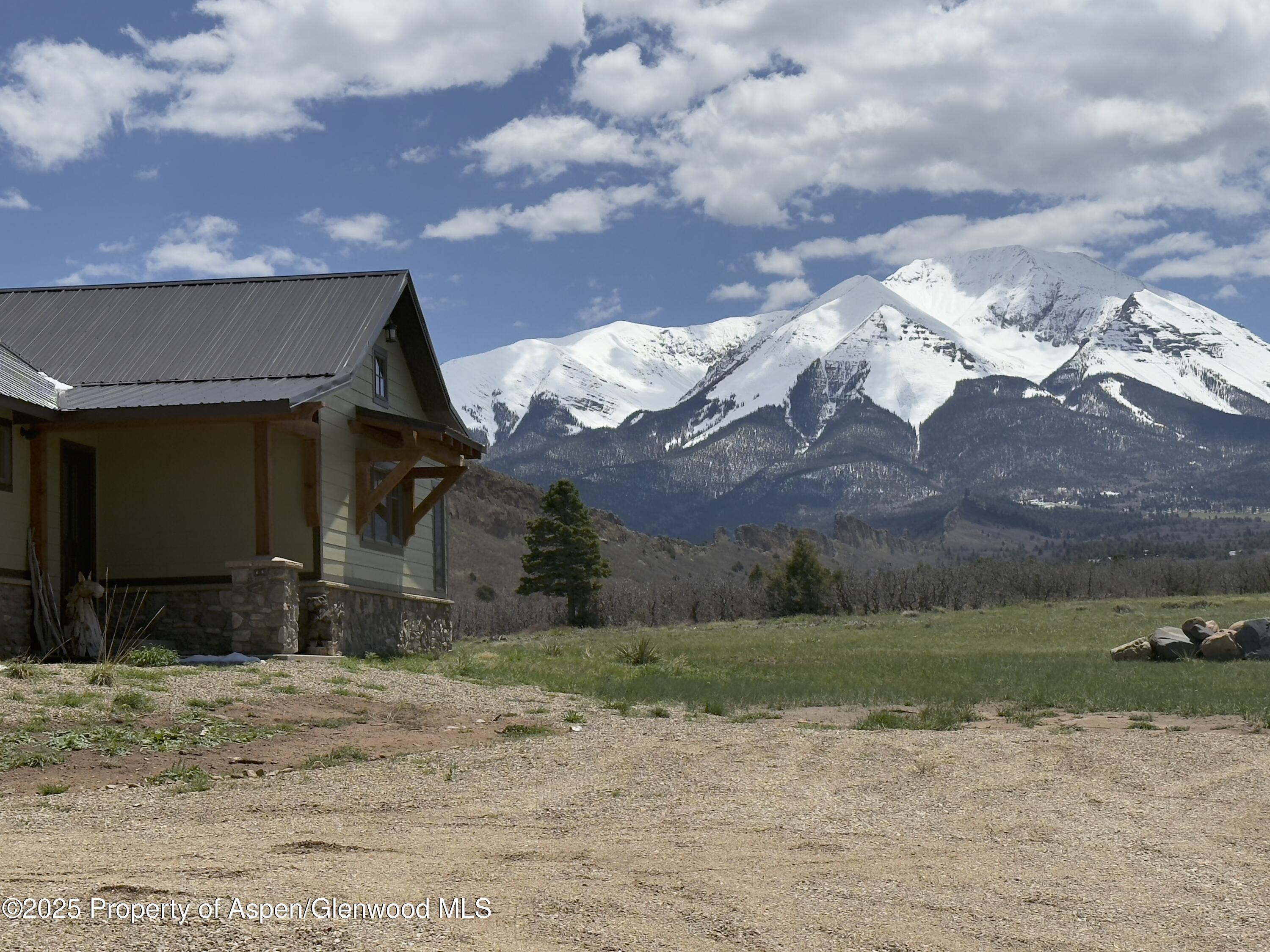 741 Big Wall Lane La Veta, CO 81055 - Photo 4 of 47 a view of a house with a yard