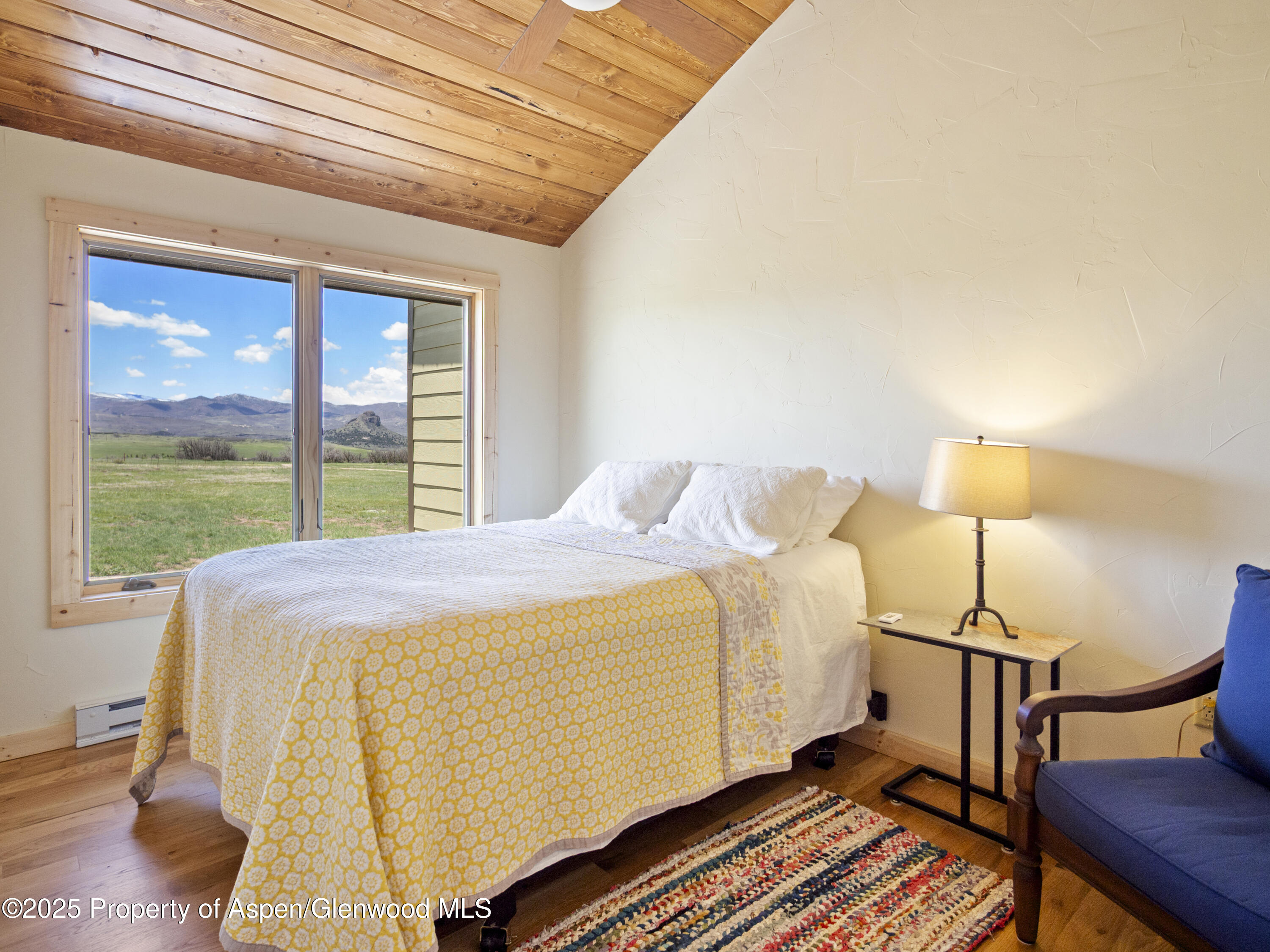 741 Big Wall Lane La Veta, CO 81055 - Photo 43 of 47 a bed sitting in a bedroom next to a window