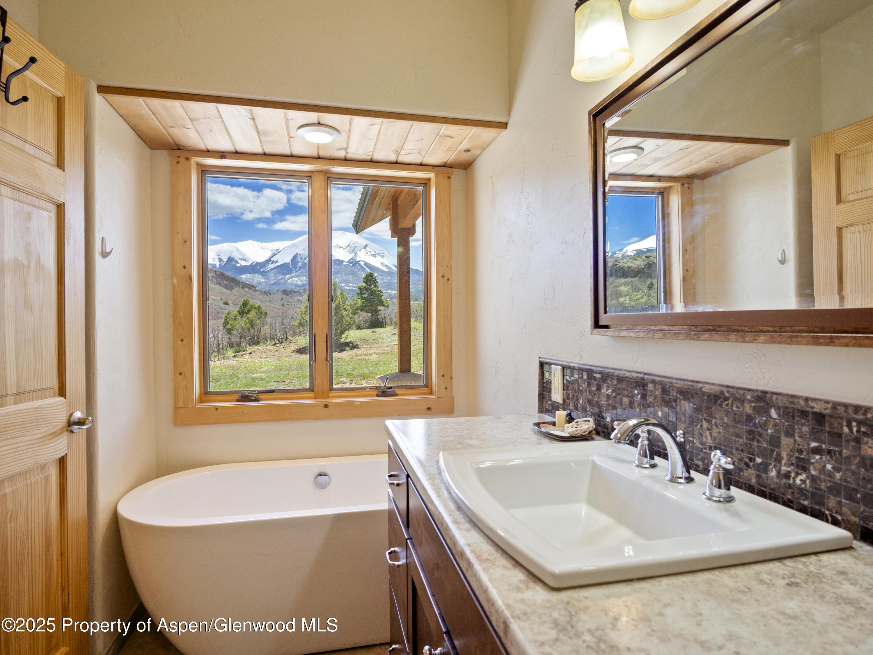 741 Big Wall Lane La Veta, CO 81055 - Photo 45 of 47 a bathroom with a sink and a bathtub