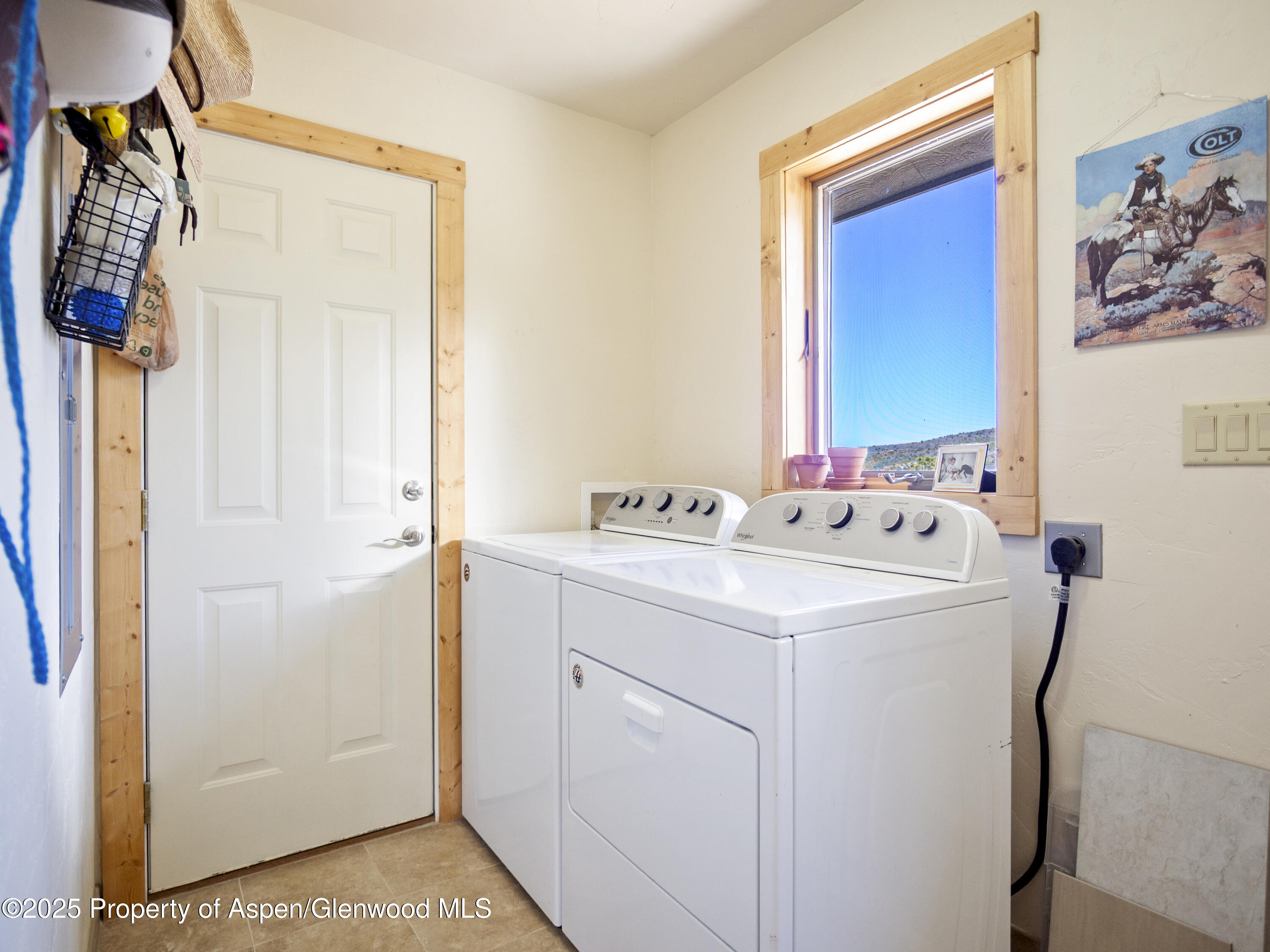 741 Big Wall Lane La Veta, CO 81055 - Photo 46 of 47 a utility room with dryer and washer