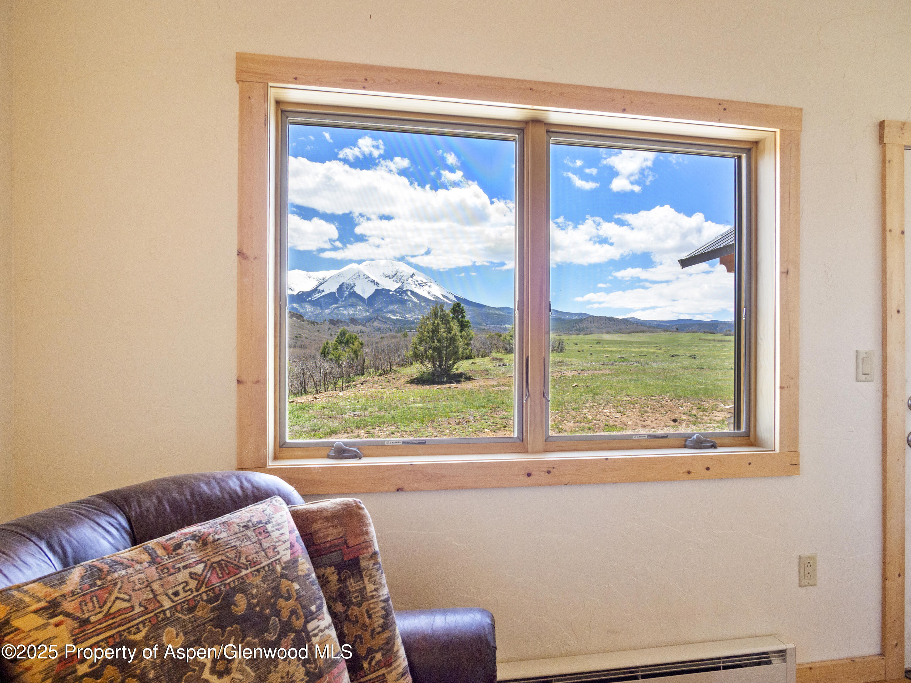 741 Big Wall Lane La Veta, CO 81055 - Photo 47 of 47 a bedroom with furniture and a window