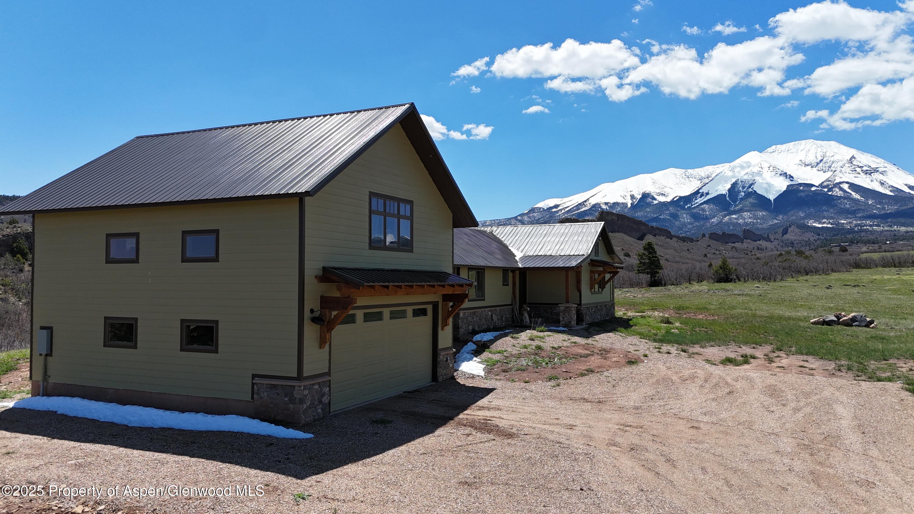741 Big Wall Lane La Veta, CO 81055 - Photo 5 of 47 a front view of house with yard