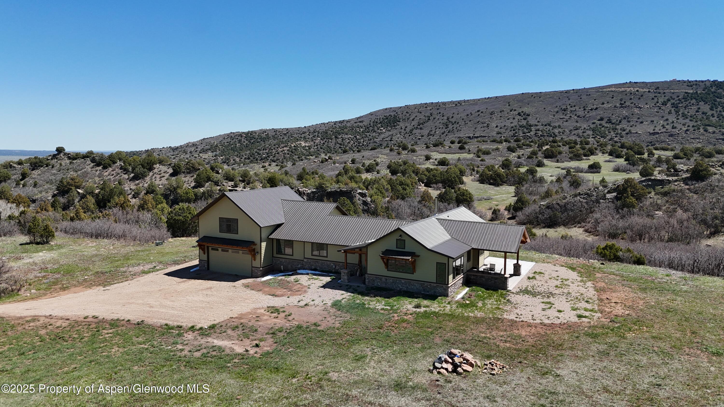 741 Big Wall Lane La Veta, CO 81055 - Photo 10 of 47 an aerial view of a house with a yard