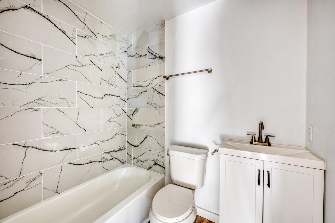 4905 Nesting Way Austin, TX 78744 - Photo 10 of 17 a bathroom with a sink toilet and shower