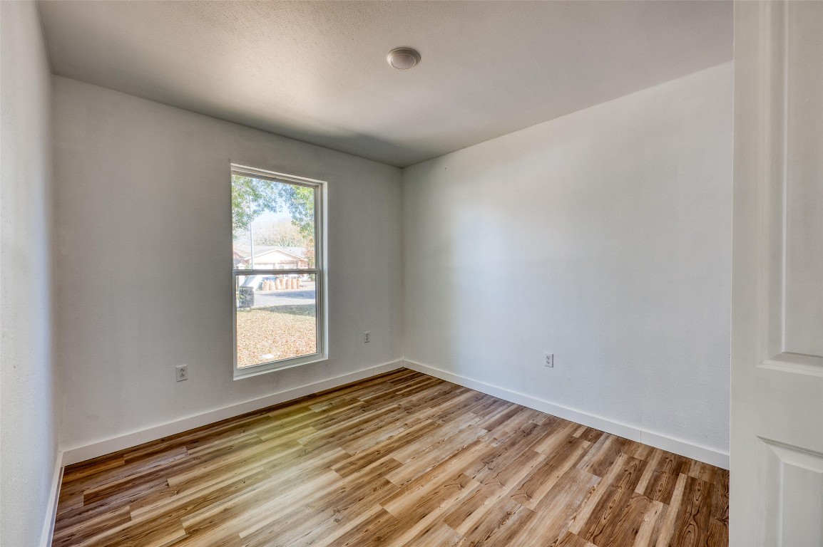 4905 Nesting Way Austin, TX 78744 - Photo 14 of 17 an empty room with a window