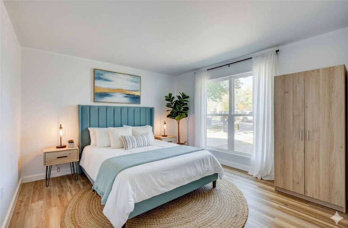 4905 Nesting Way Austin, TX 78744 - Photo 15 of 17 a bedroom with a bed and a window