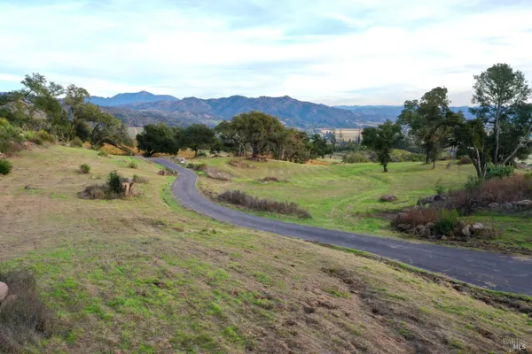 an aerial view of a house with swimming pool garden and patio