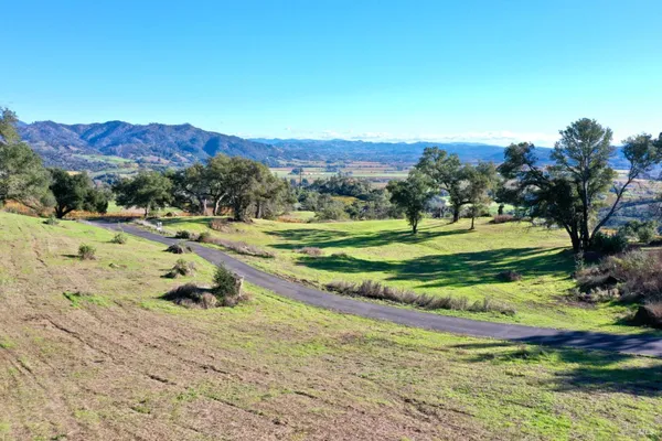 a view of a city with mountains in the background