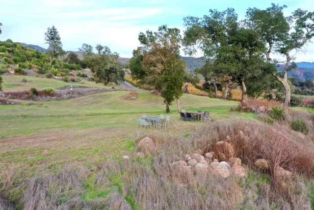 a view of a lake with a yard