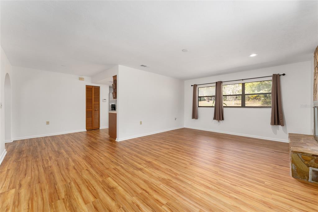 20290 Southwest 97th Place Dunnellon, FL 34431 - Photo 15 of 73 wooden floor in an empty room with a window