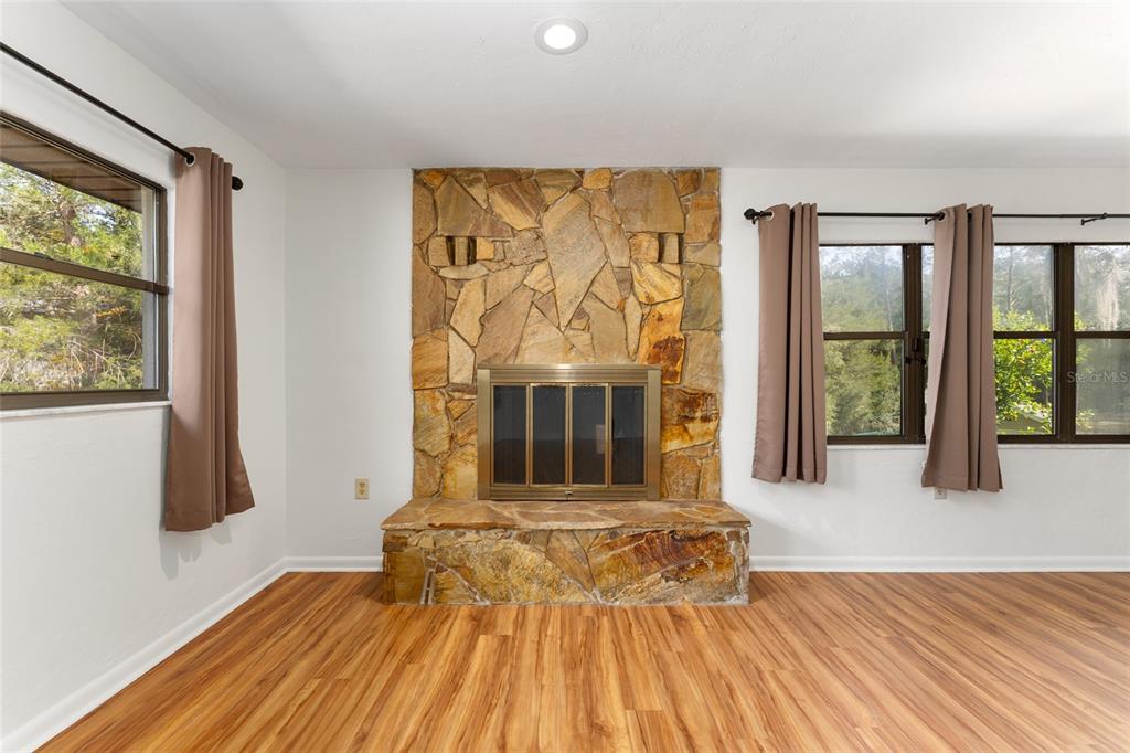 20290 Southwest 97th Place Dunnellon, FL 34431 - Photo 17 of 73 a bedroom with a bed and a large window