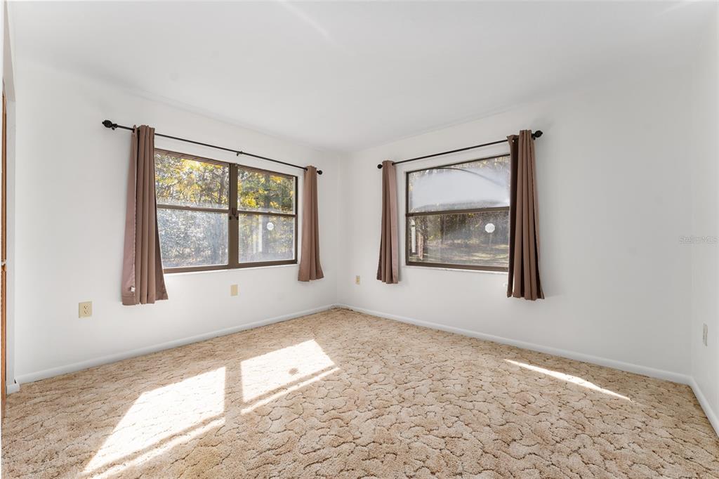 20290 Southwest 97th Place Dunnellon, FL 34431 - Photo 29 of 73 a view of an empty room with a window