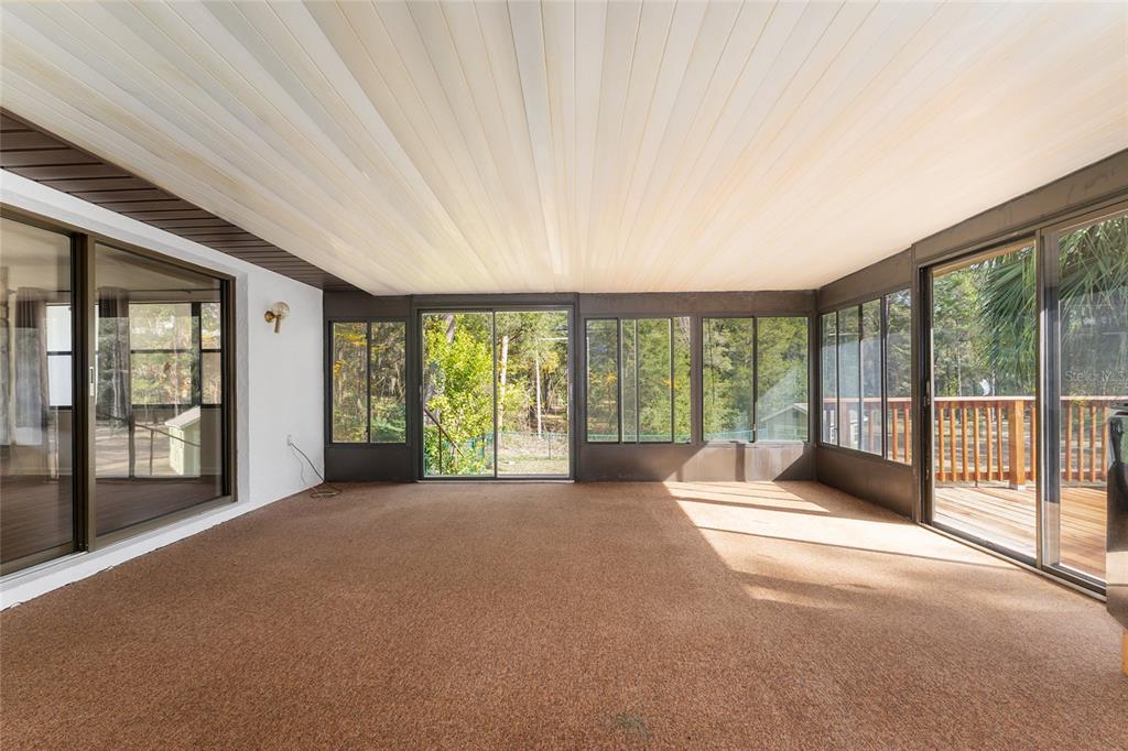 20290 Southwest 97th Place Dunnellon, FL 34431 - Photo 31 of 73 a view of an empty room with windows and a balcony