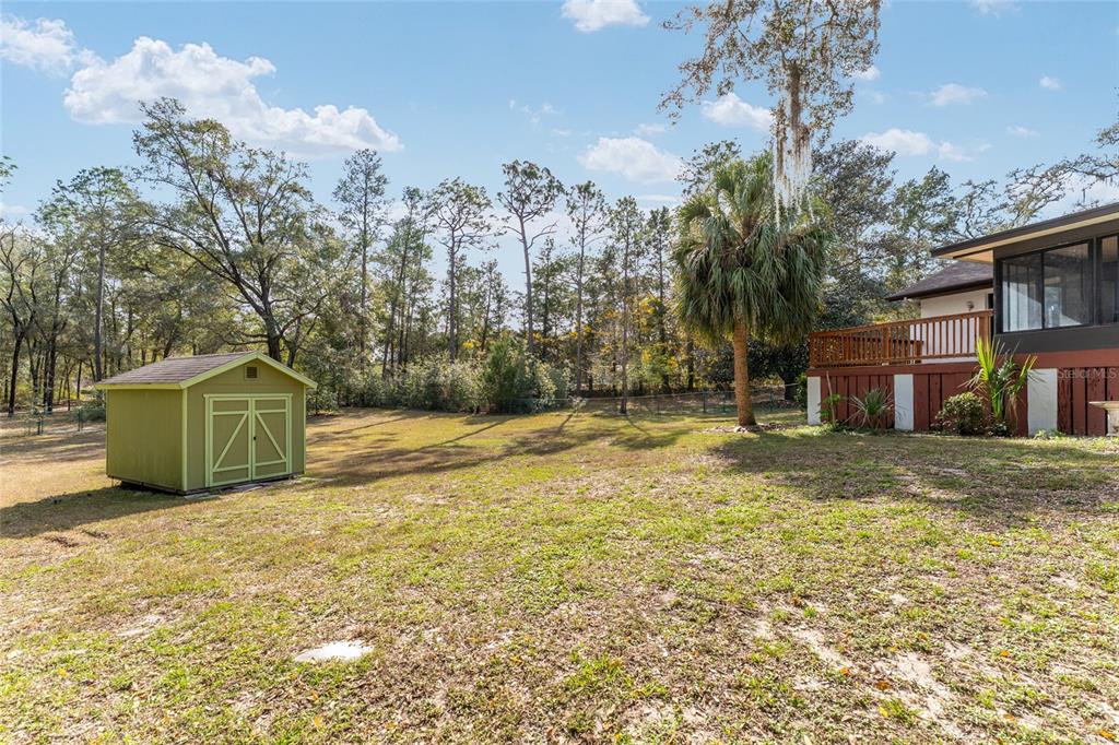 20290 Southwest 97th Place Dunnellon, FL 34431 - Photo 35 of 73 a view of a house with a yard