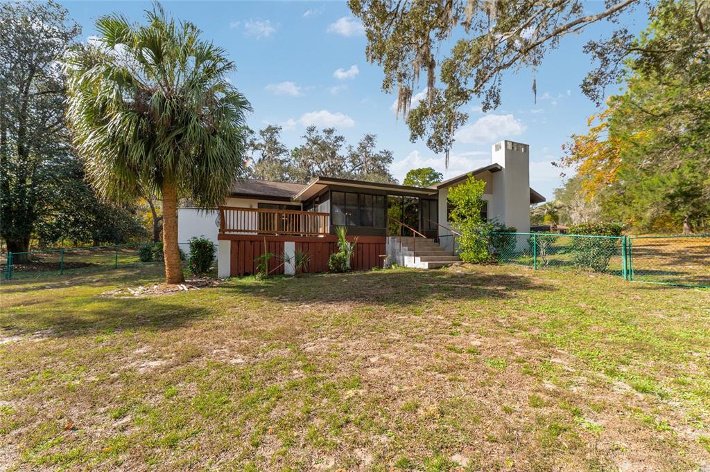 20290 Southwest 97th Place Dunnellon, FL 34431 - Photo 36 of 73 a front view of a house with a yard