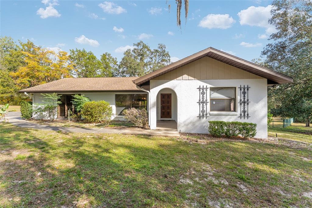 20290 Southwest 97th Place Dunnellon, FL 34431 - Photo 47 of 73 a view of a house with a yard