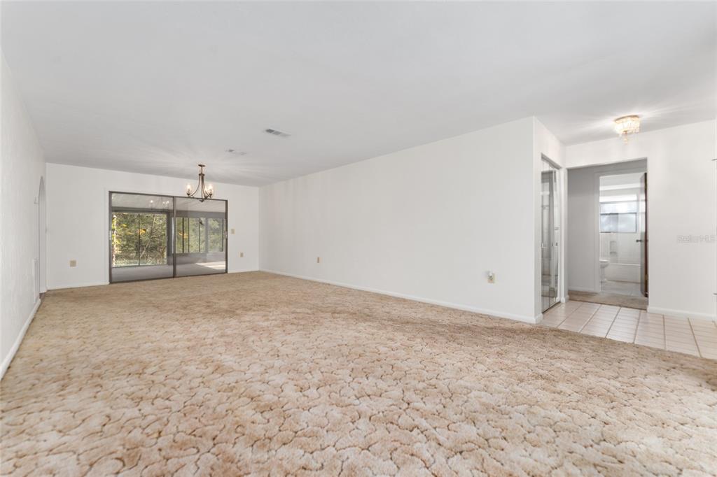 20290 Southwest 97th Place Dunnellon, FL 34431 - Photo 7 of 73 a view of an empty room with a window