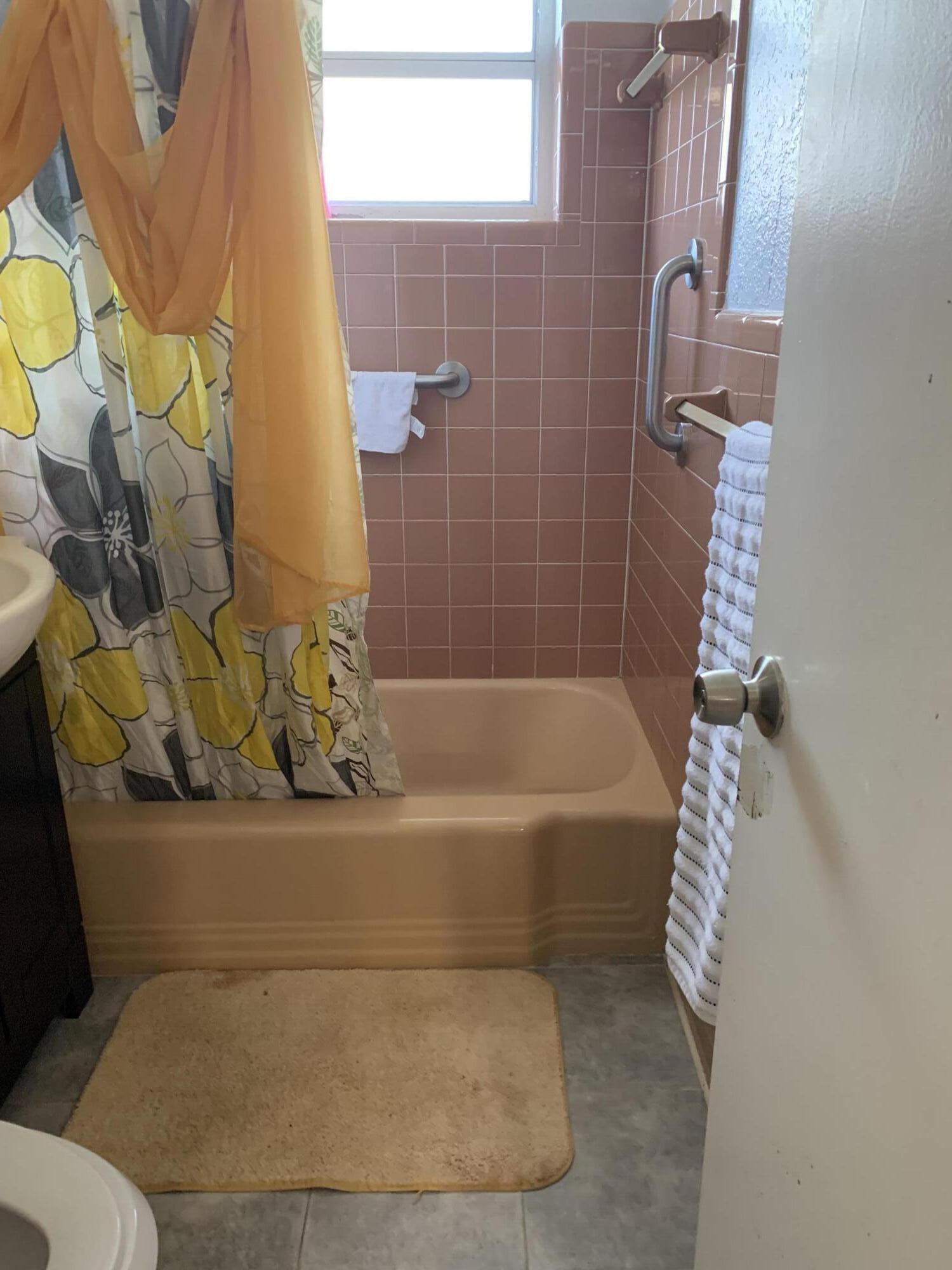 1014 Old Boynton Road Boynton Beach, FL 33426 - Photo 5 of 10 a bathroom with a bathtub and shower