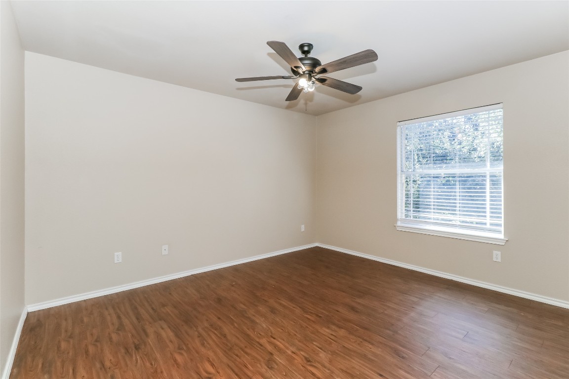 3816 Bandice Lane Pflugerville, TX 78660 - Photo 13 of 18 a view of an empty room with wooden floor and a window