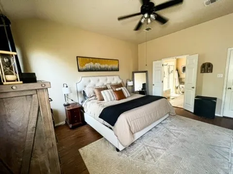 a bedroom with a bed and a couch