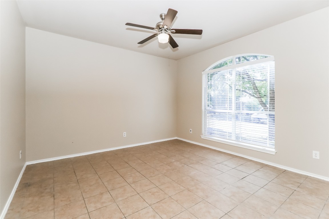 3816 Bandice Lane Pflugerville, TX 78660 - Photo 14 of 18 an empty room with windows and fan