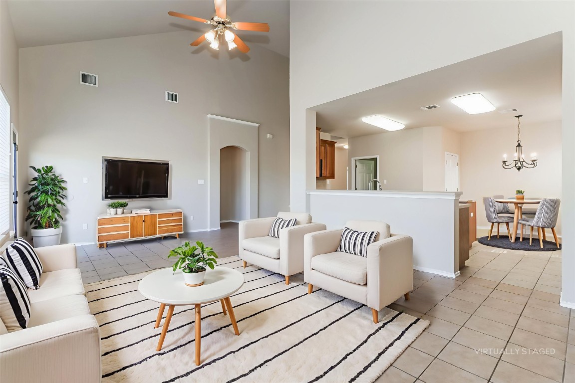 3816 Bandice Lane Pflugerville, TX 78660 - Photo 2 of 18 a living room with furniture and a flat screen tv