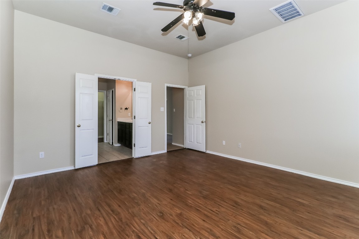 3816 Bandice Lane Pflugerville, TX 78660 - Photo 10 of 18 a view of an empty room with wooden floor