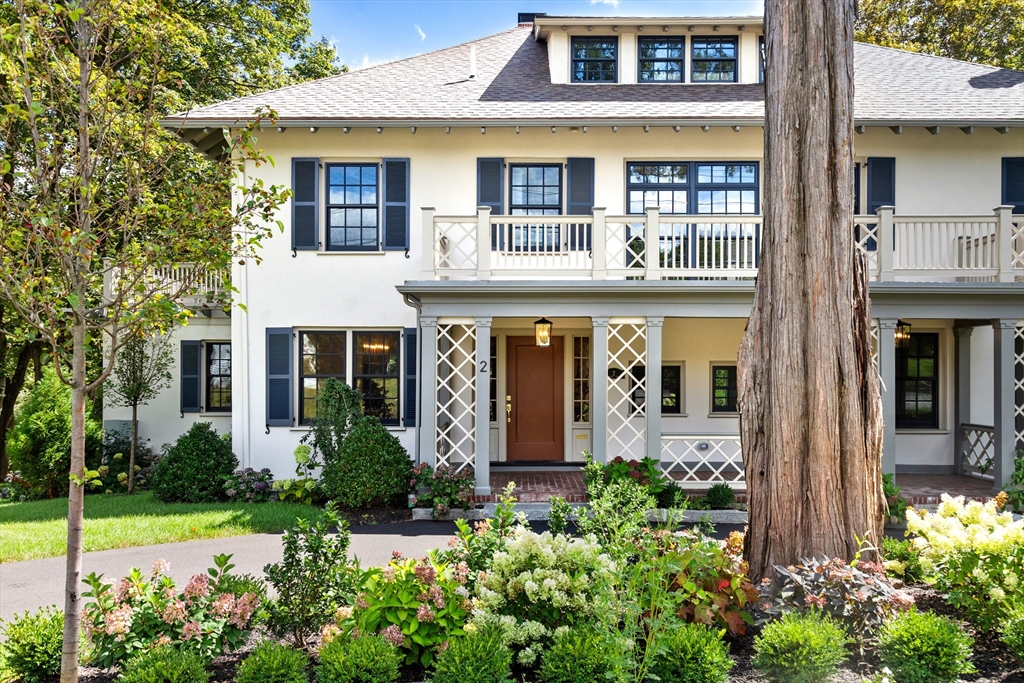 2 Percy Road Lexington, MA 02421 - Photo 1 of 31 front view of a brick house with a large window