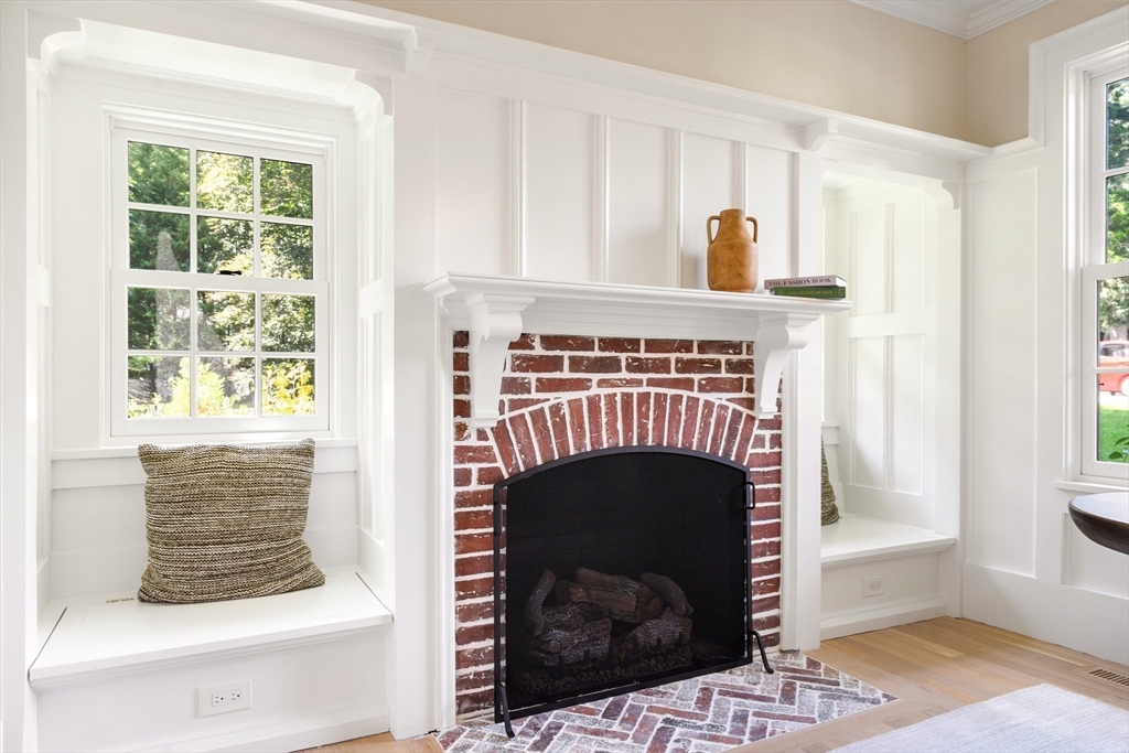 2 Percy Road Lexington, MA 02421 - Photo 14 of 31 a living room with a fireplace and a window