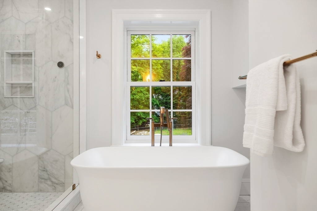 2 Percy Road Lexington, MA 02421 - Photo 21 of 31 a close up of a bathtub in a bathroom