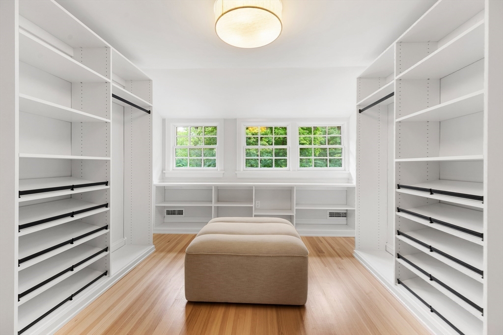 2 Percy Road Lexington, MA 02421 - Photo 22 of 31 a bedroom with a bed and wooden floor
