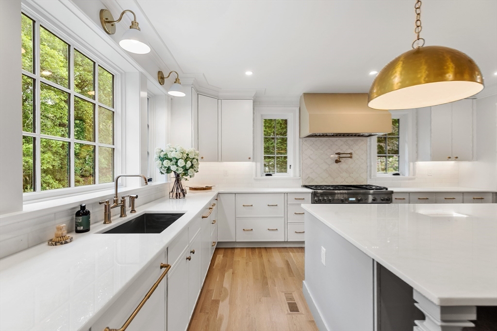 2 Percy Road Lexington, MA 02421 - Photo 6 of 31 a kitchen with a sink stove and refrigerator