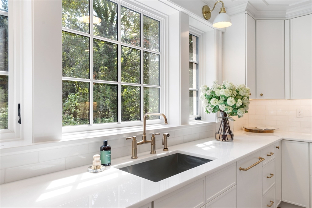 2 Percy Road Lexington, MA 02421 - Photo 7 of 31 a bathroom with a granite countertop sink and a window